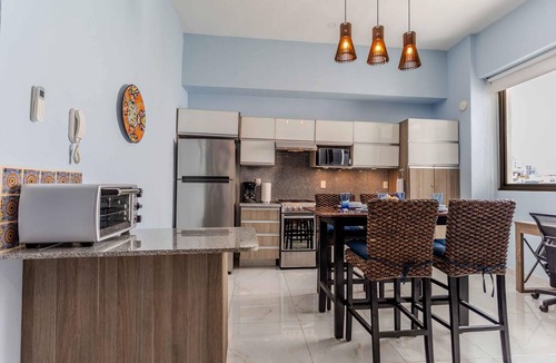 Emiliano Zapata Condo | 5 min to Los Muertos Beach in front of Cuale River located in Isla Cuale! 1BD Co