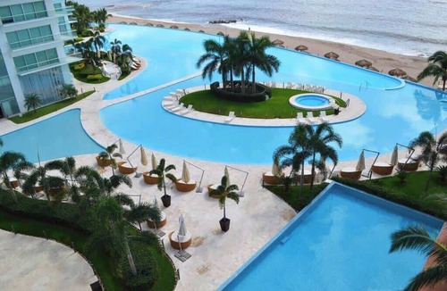North Hotel Zone Condo | Beachfront Bliss, Gorgeous Pools in Peninsula bldg