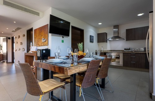 Playacar Fase II Condo | Comfortable family condo with rooftop jetted hot tub, pool & full kitchen