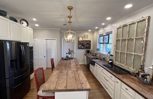 Aiken House | Gated property with historic main home + charming cottage.
