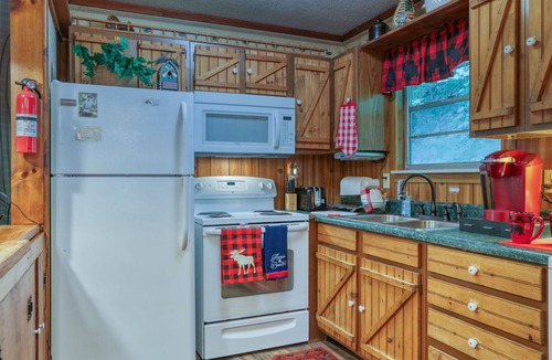 Sevierville Cabin | Secluded Riverfront Cabin Sounds of the River Screened Porch Gazebo Hot Tub