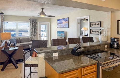 Pass-a-Grille Historic District Condo | Spacious corner unit on Pass-A-Grille Beach. Beach access Heated pool. Next to restaurants and shops