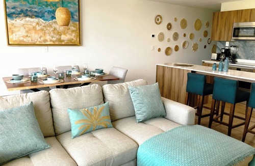 Playacar Condo | Stylish Playacar Condo · Spacious Balcony & Pool