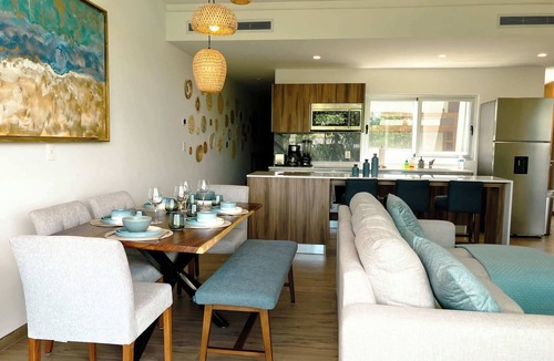 Playacar Condo | Stylish Playacar Condo · Spacious Balcony & Pool