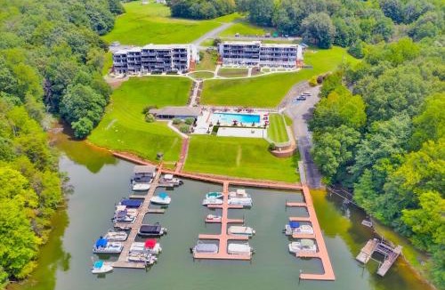 North Shore House | Sunset Landing - Waterfront condo with lake-view deck, tennis court & pool