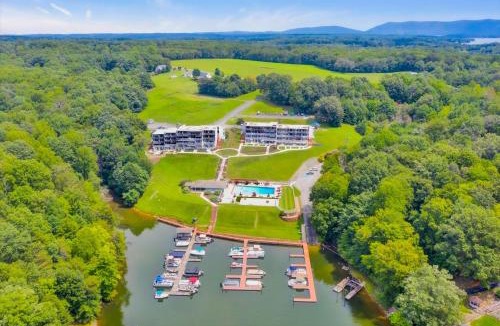 North Shore House | Sunset Landing - Waterfront condo with lake-view deck, tennis court & pool