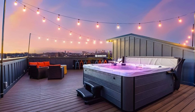 Summer rooftop hot tubs, sauna, game rooms near Geodis Park & Broadway